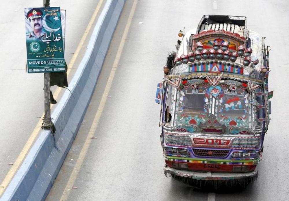 


A bus moves past a banner hanging on a light pole with the picture of Pakistan’s ex-army chief Gen. Raheel Sharif along a road in Karachi, Pakistan, in this Feb. 25, 2016 file photo. — Reuters