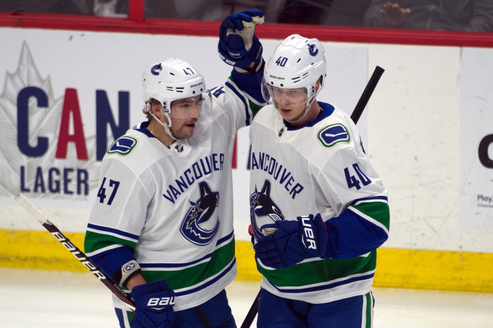 Vancouver Canucks left wing Sven Baertschi (47) celebrates a goal scored by center Elias Pettersson (40) in the third period against the Ottawa Senator at the Canadian Tire Centre. — Reuters