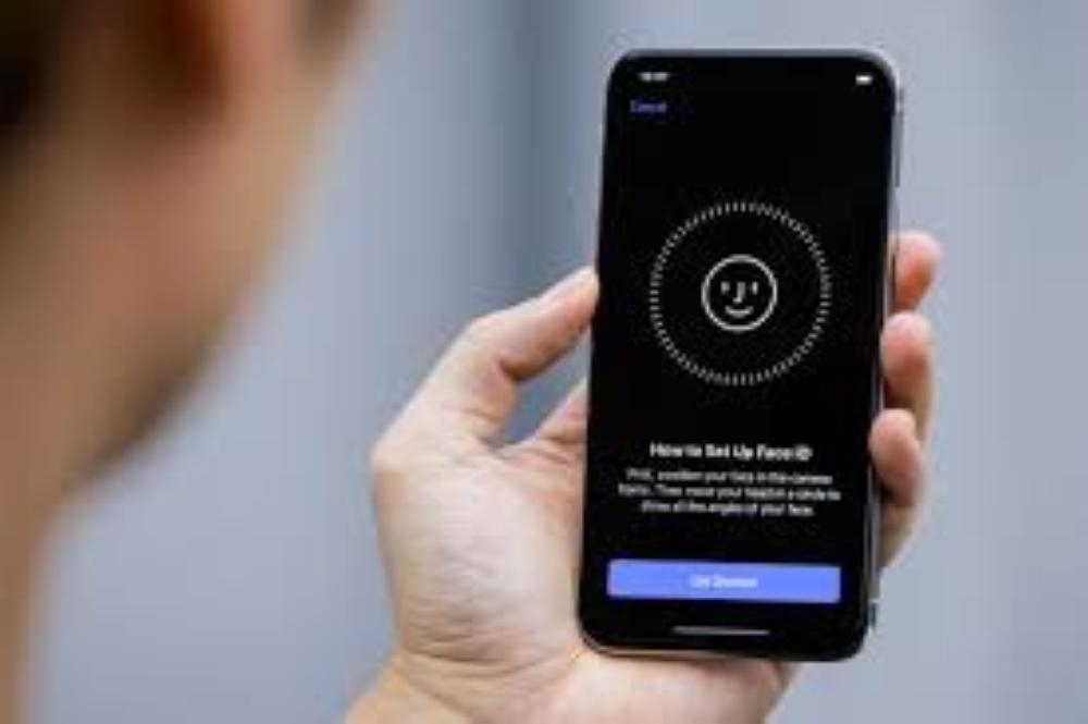 An attendee uses the Face ID function on the new iPhone X during a presentation for the media in Beijing, China, in this file photo. — Reuters