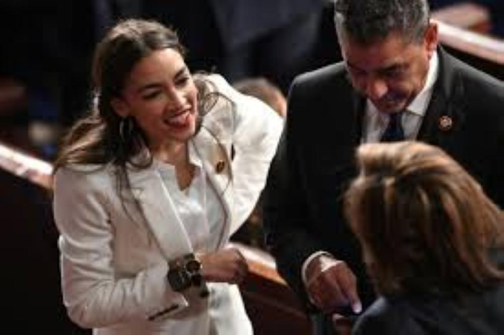 New US congresswoman and leftist poster child Alexandria Ocasio-Cortez being sworn-in. – AFP