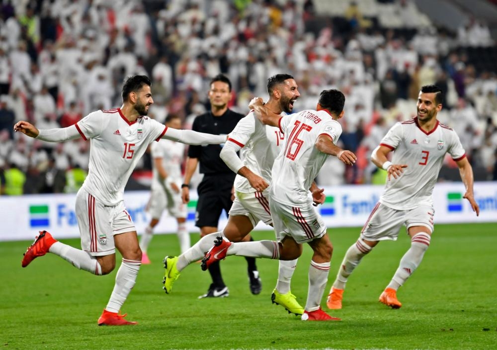 Iran's midfielder Saman Ghoddos (2nd R) celebrates after scoring a goal during the 2019 AFC Asian Cup Group D football match against Yemen at the Mohammed Bin Zayed Stadium in Abu Dhabi Monday. — AFP