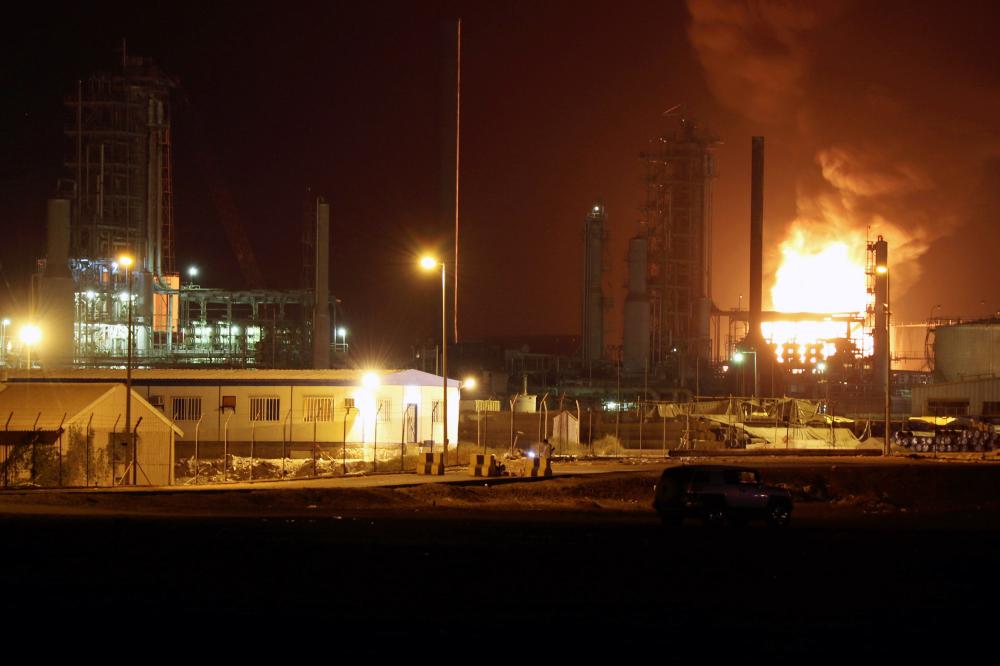 Fire engulfs an oil storage tank at the Aden oil refinery following an explosion in Aden, Yemen on Friday.  — Reuters