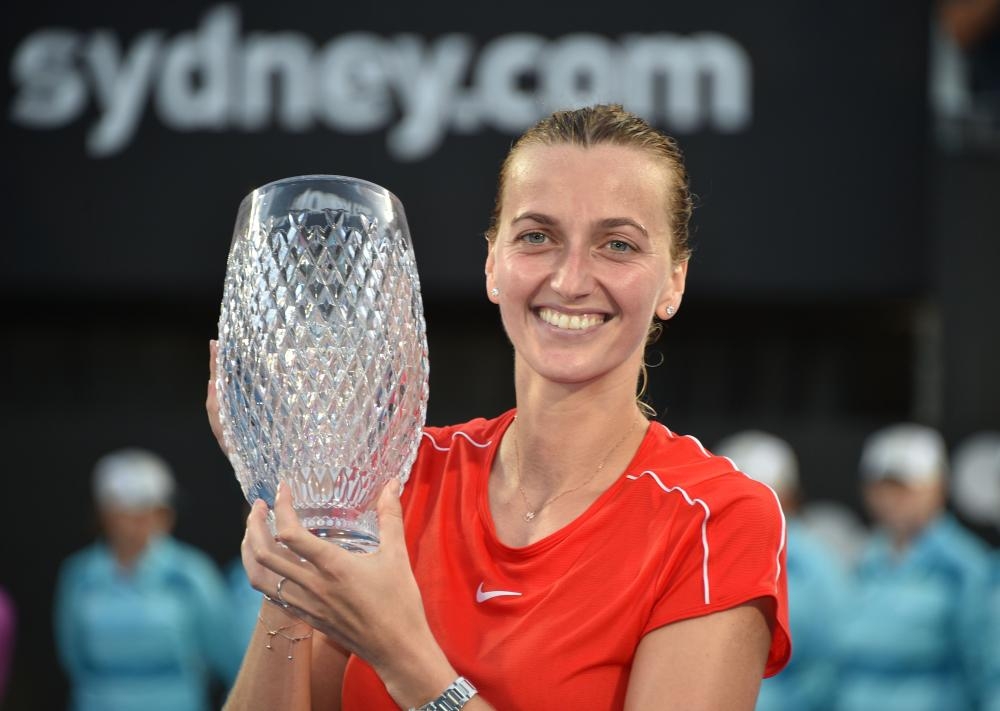 Australia’s Alex De Minaur holds the trophy after beating Andreas Seppi of Italy in the final at the Sydney International Tennis Tournament Saturday. — AFP 