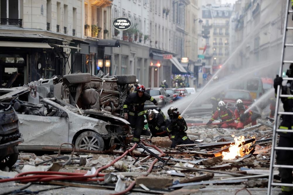 Firefighters intervene after the explosion of a bakery on the corner of the streets Saint-Cecile and Rue de Trevise in central Paris on Saturday. A large explosion badly damaged a bakery in central Paris injuring several people and smashing windows in surrounding buildings. — AFP