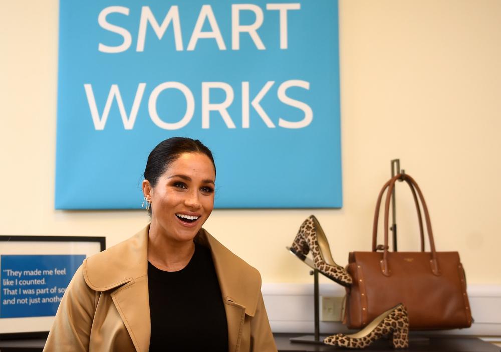 Meghan, the Duchess of Sussex, smiles during her visit at Smart Works charity in West London, Britain. — Reuters