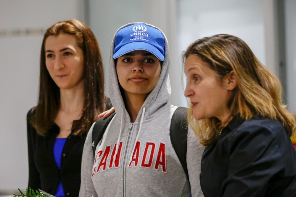 Rahaf Al-Qunun (C) accompanied by Canadian Minister of Foreign Affairs Chrystia Freeland (R) and Saba Abbas, general counsellor of COSTI refugee service agency, arrives at Toronto Pearson International Airport in Toronto, Ontario, Canada on Saturday. — Reuters