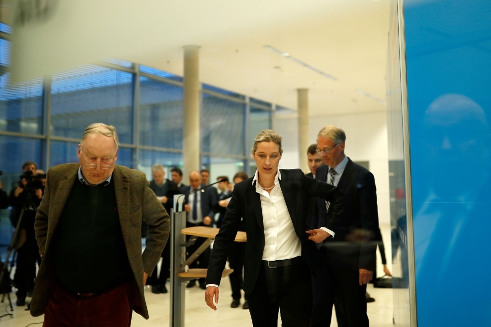 Co-leader of the Alternative for Germany (AfD) far-right party Alexander Gauland, left (L) and AfD parliamentary group co-leader Alice Weidel leave after press conference on plans of Germany’s domestic intelligence agency BfV to place the party under surveillance in Berlin on Tuesday. — AFP
