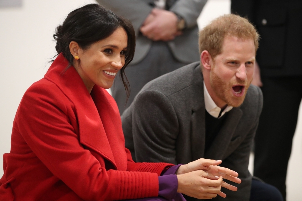 Britain's Prince Harry, Duke of Sussex and Meghan, Duchess of Sussex, watch a dance troupe perform at the Hive, Wirral Youth Zone, during their visit to Birkenhead, northwest England on Monday. — AFP