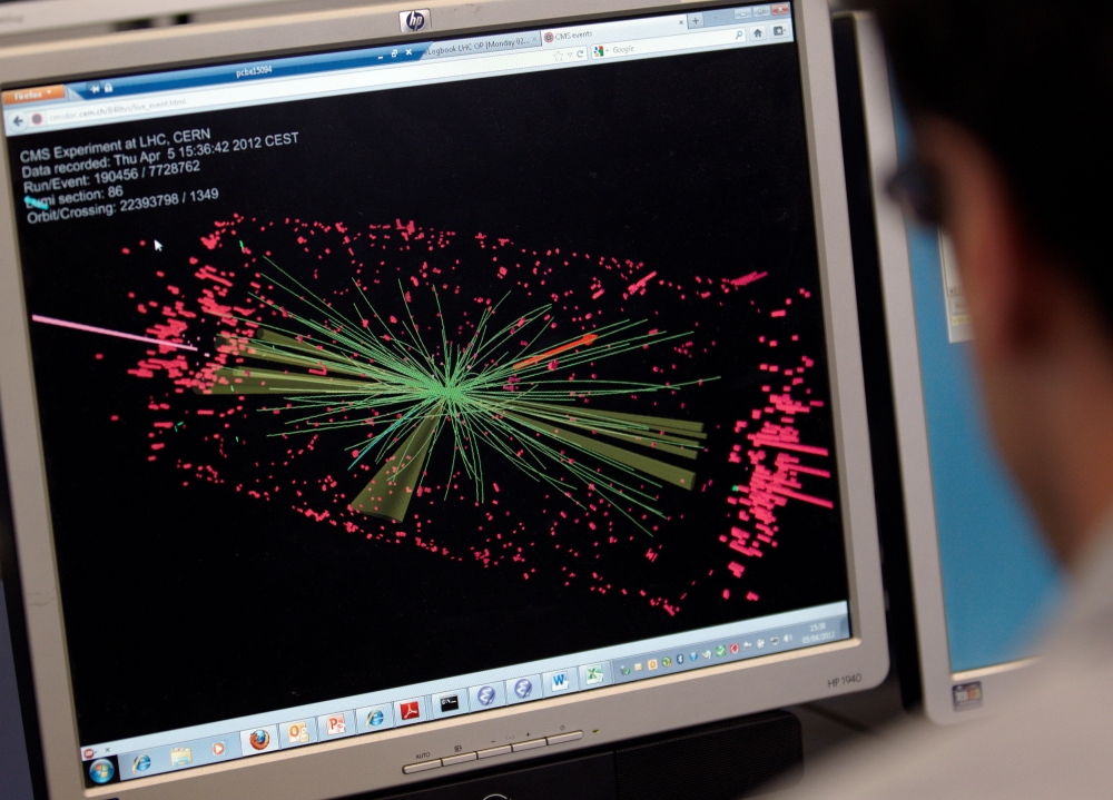 A technician looks at collision at the CMS experiment in the control room of the Large Hadron Collider (LHC) at the European Organisation for Nuclear Research (CERN) near Geneva, in this file photo. — Reuters