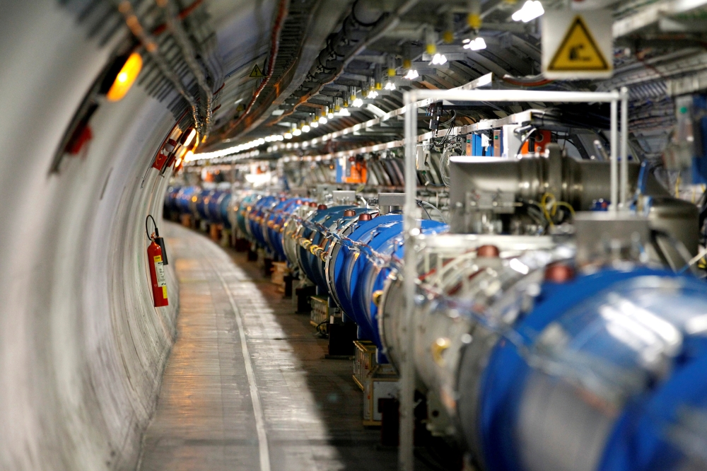 A technician looks at collision at the CMS experiment in the control room of the Large Hadron Collider (LHC) at the European Organisation for Nuclear Research (CERN) near Geneva, in this file photo. — Reuters