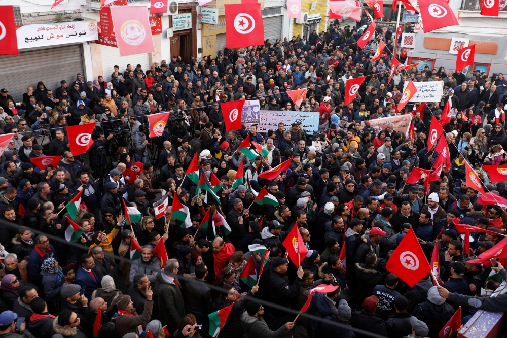 People gather during a nationwide strike against the government’s refusal to raise wages in Tunis, Tunisia, on Thursday. — Reuters