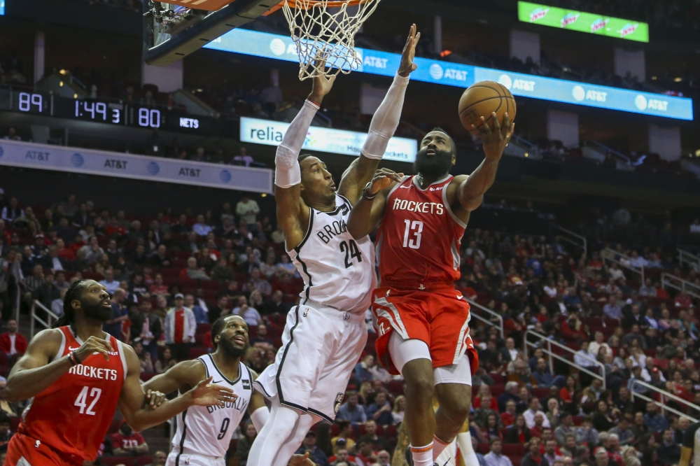 Houston Rockets guard James Harden (13) shoots a layup against Brooklyn Nets forward Rondae Hollis-Jefferson (24) during the third quarter at Toyota Center. — Reuters