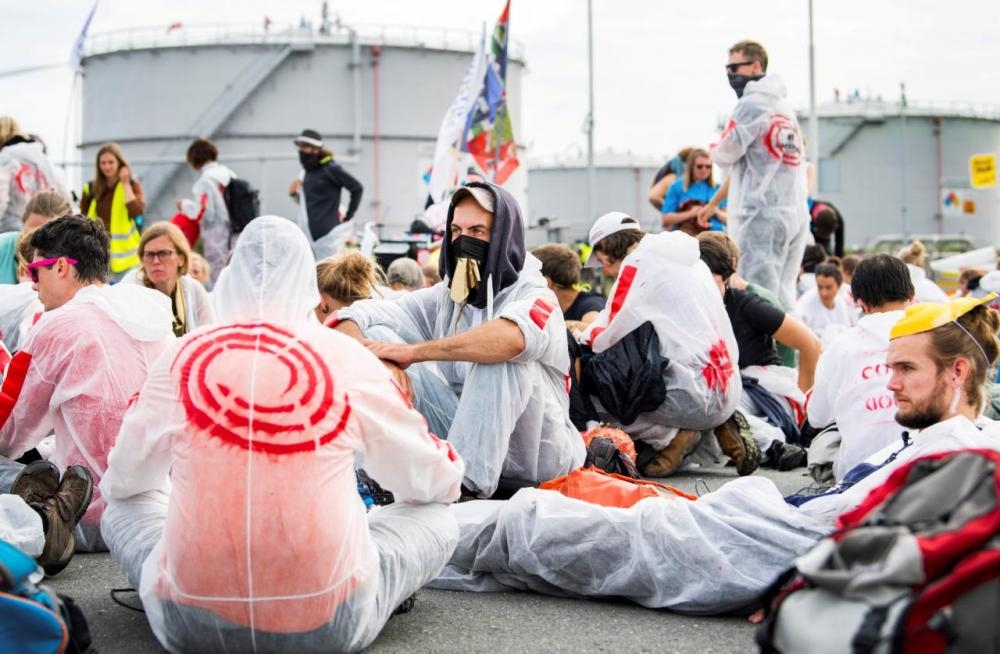 Protesters demand an immediate end to gas extraction at the Groningen field as they block a facility of Dutch gas production company NAM, in Farmsum, Netherlands, in this file photo. — Reuters