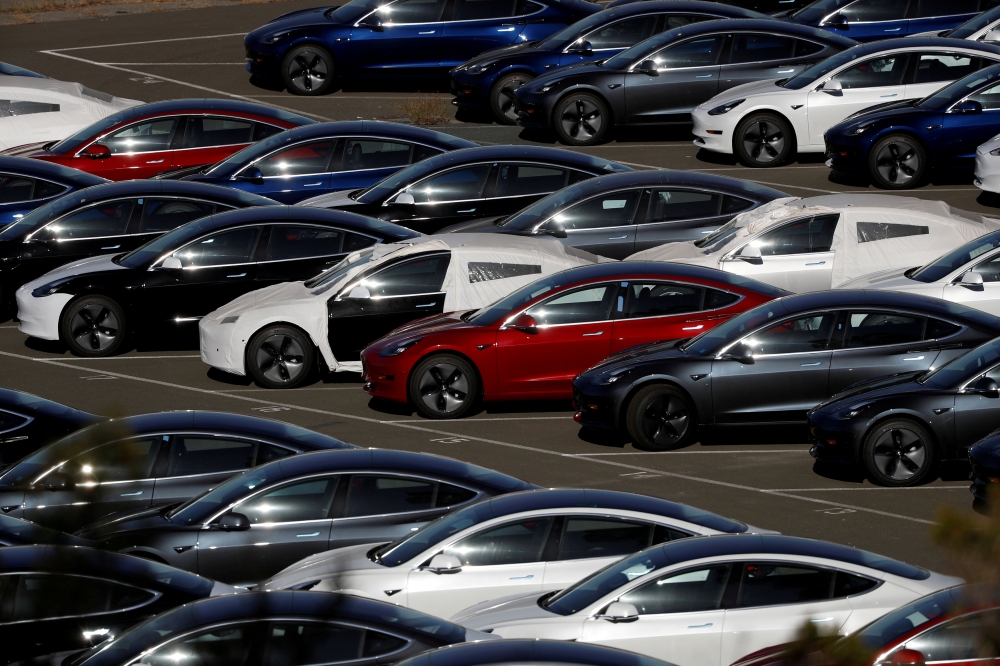 Rows of new Tesla Model 3 electric vehicles are seen in Richmond, California, in this recent photo. — Reuters