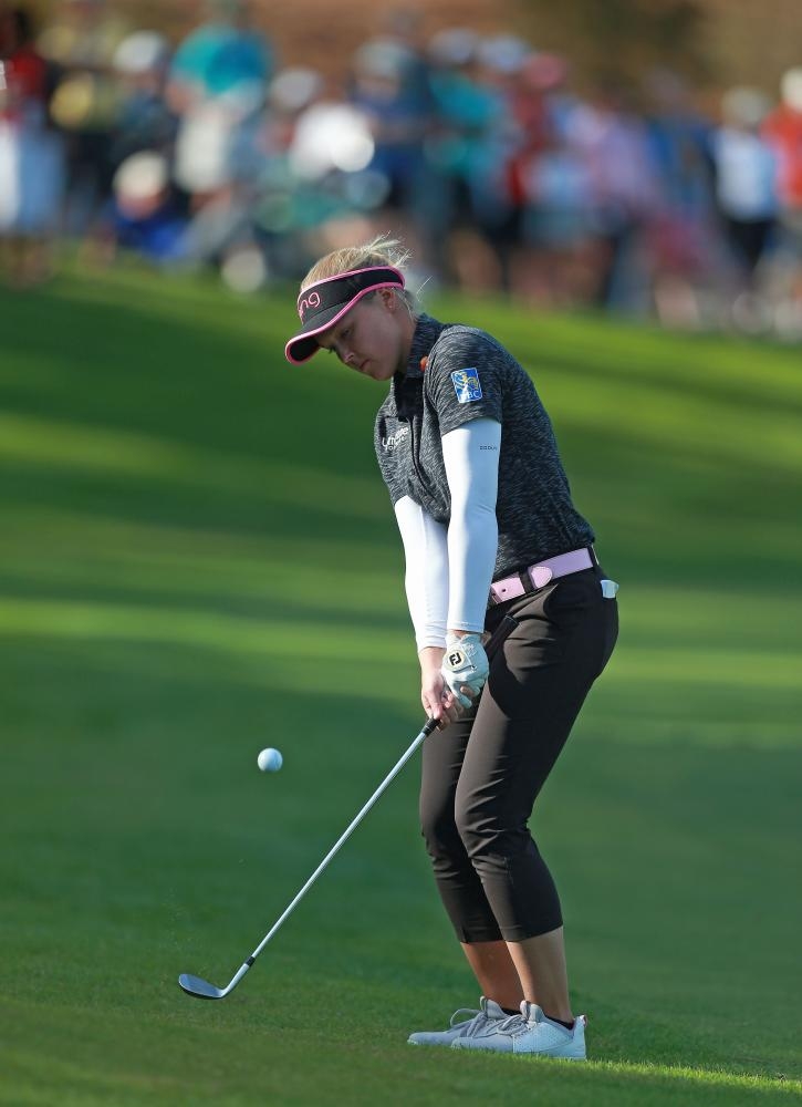 Brooke Henderson of Canada hits her second shot on the 18th hole during the second round of the Diamond Resorts Tournament of Champions at Tranquilo Golf Course at Four Seasons Golf and Sports Club Orlando in Lake Buena Vista, Florida, Friday. — AFP