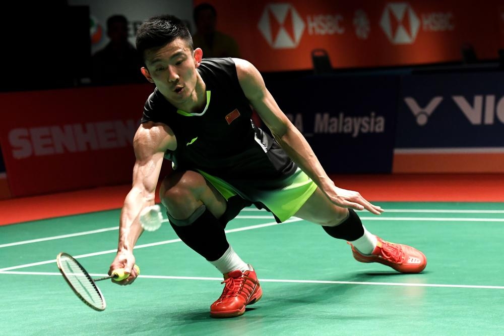 Chen Long of China hits a return against Viktor Axelsen of Denmark during their semifinal match at the Malaysia Masters Badminton Tournament in Kuala Lumpur Saturday. — AFP 