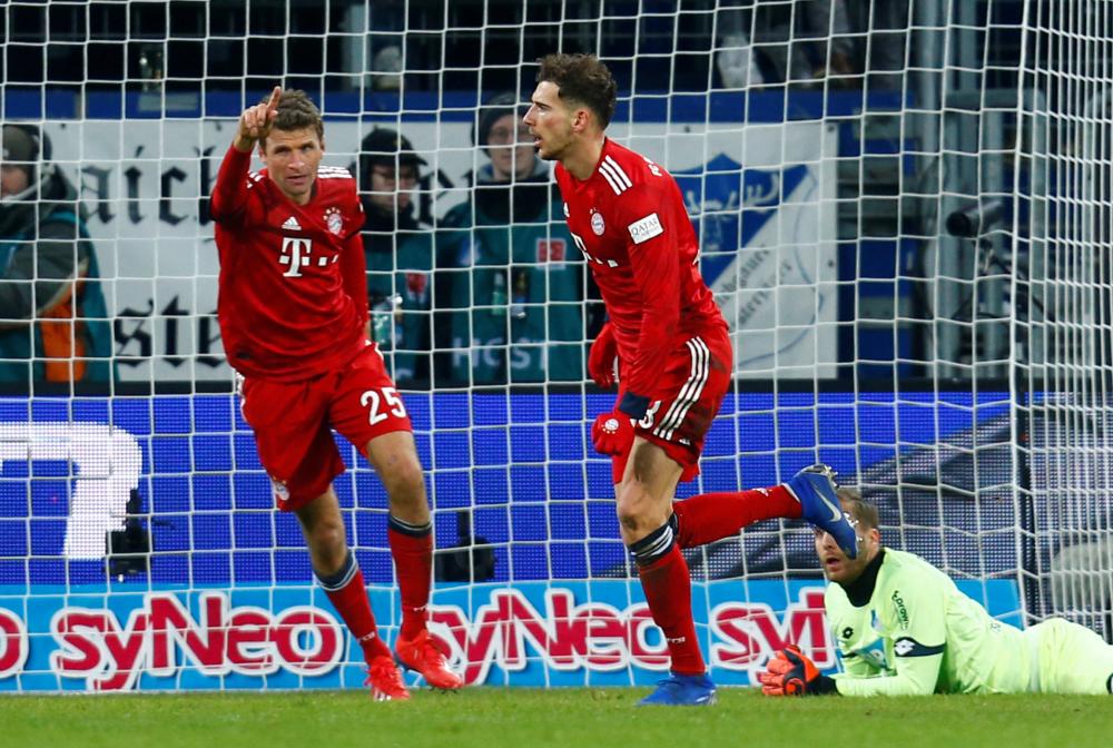 Bayern Munich’s Leon Goretzka (R) celebrates scoring their second goal with Thomas Mueller against Hoffenheim during their Bundesliga match at PreZero Arena, Sinsheim, Germany, Friday. — Reuters
