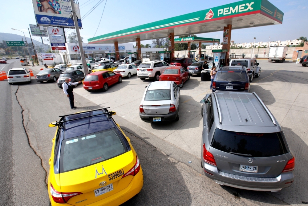 Motorists queue at a Pemex service station in Tlajomulco, Jalisco State, Mexico,Saturday as a controversial government crackdown to fight fuel theft has led to severe gasoline and diesel shortages across much of the country. — AFP 