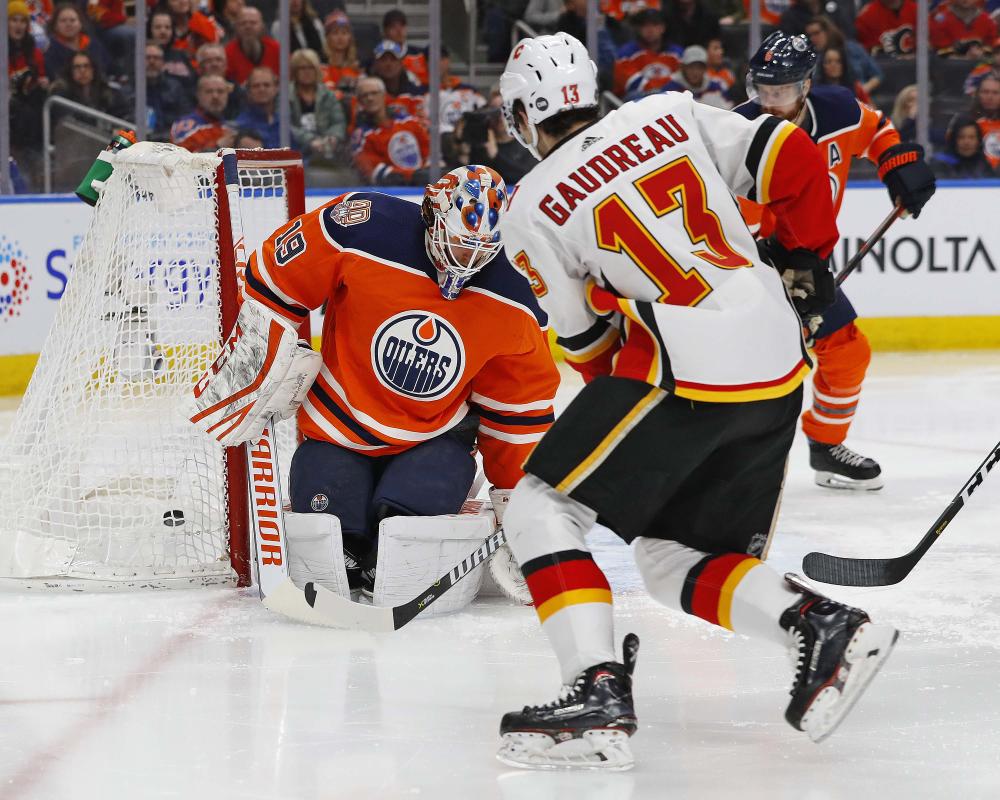 Calgary Flames’ forward Johnny Gaudreau scores a second period goal against Edmonton Oilers goaltender Mikko Koskinen at Rogers Place in Edmonton, Alberta, Saturday. — Reuters