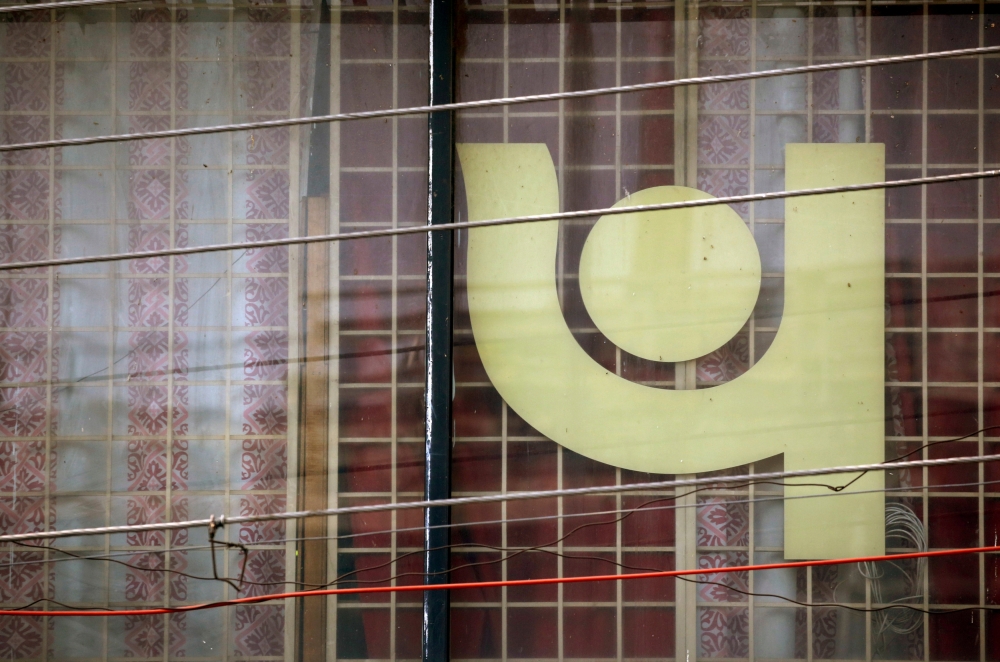 The logo of Punjab National Bank (PNB) is seen on a branch office window in New Delhi. — Reuters
