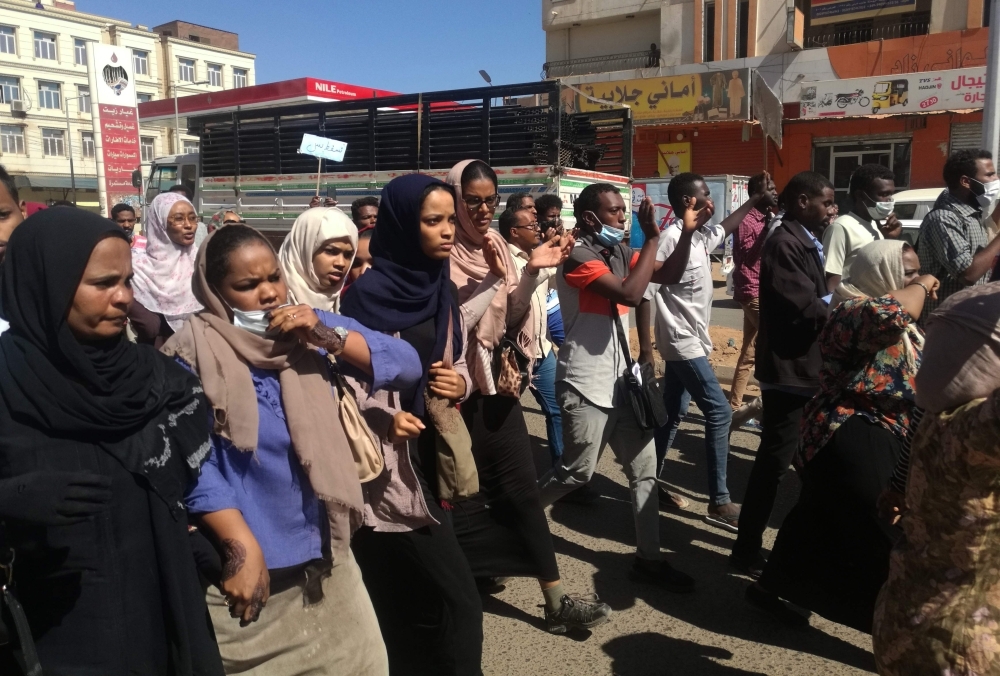 Sudanese demonstrators gather in Khartoum's twin city Omdurman on Sunday, where Sudanese police fired tear gas at protesters ahead of a planned march on parliament. — AFP