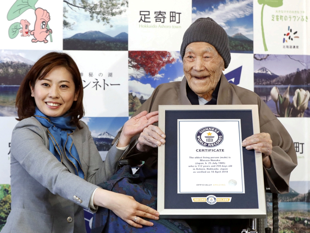 Japanese Masazo Nonaka, who was born 112 years and 259 days ago, receives a Guinness World Records certificate naming him the world's oldest man during a ceremony in Ashoro, on Japan's northern island of Hokkaido. — Reuters