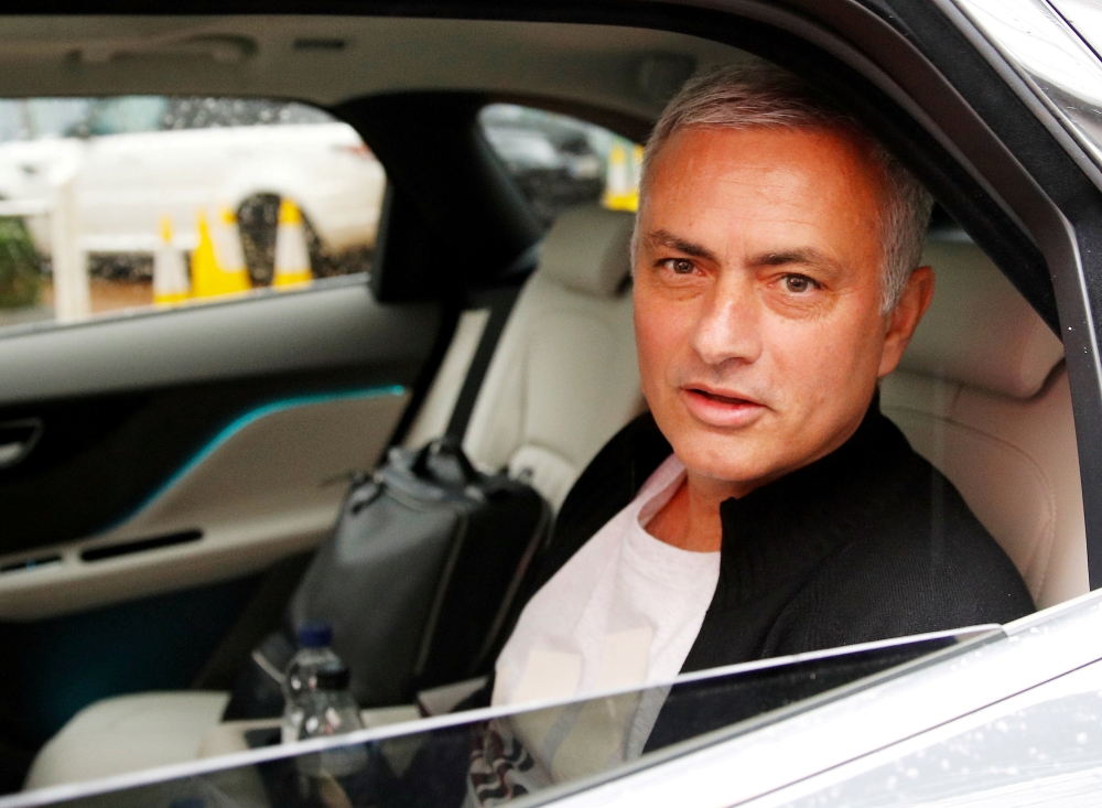 Jose Mourinho is driven away after leaving his job as Manchester United's manager, in Manchester, Britain, in this file photo. — Reuters