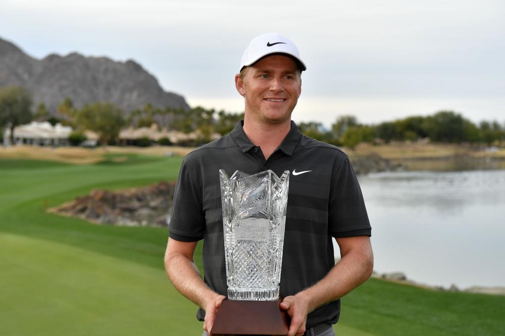 Adam Long of the US poses with the trophy after winning the Desert Classic at the Stadium Course in La Quinta, California, Sunday. — AFP