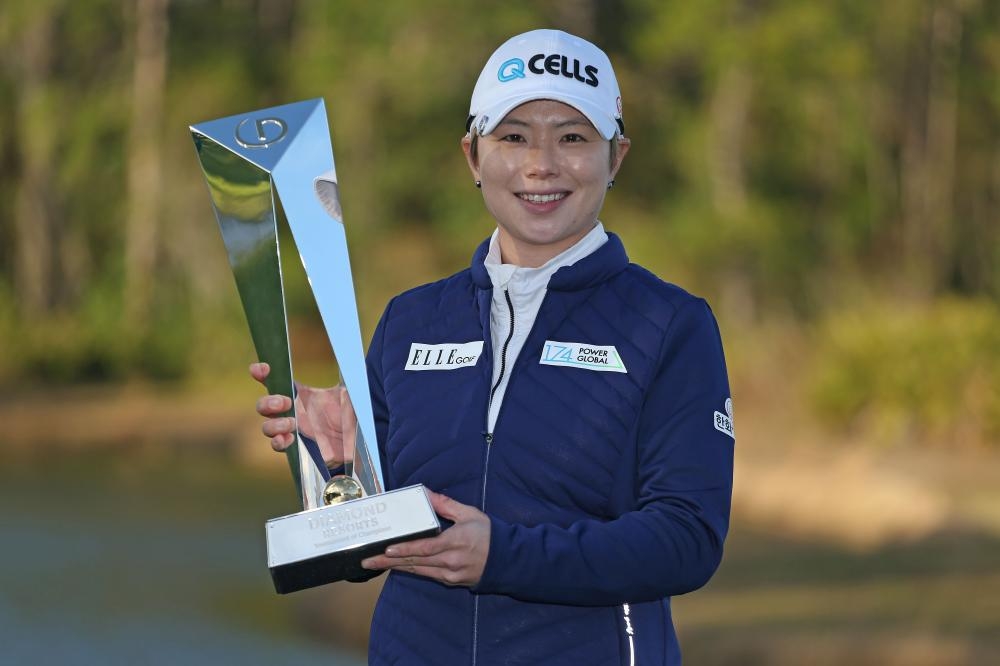 Ji Eun-hee of South Korea poses with the trophy after winning the Diamond Resorts Tournament of Champions at Tranquilo Golf Course at Four Seasons Golf and Sports Club Orlando in Lake Buena Vista, Florida, Sunday. — AFP 