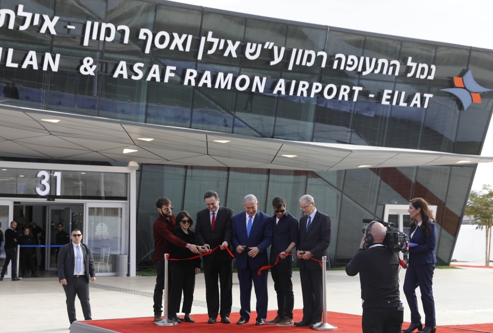 


Israeli Prime Minister Benjamin Netanyahu (center) and Transportation Minister Israel Katz (center-left) attend the inauguration of new international Ramon Airport, located some 18 km north of the southern Israeli Red Sea resort city of Eilat, Monday. — AFP