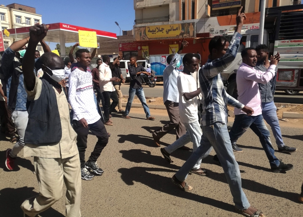 Sudanese demonstrators gather in Khartoum’s twin city Omdurman on Sunday, where Sudanese police fired tear gas at protesters ahead of a planned march on parliament. — AFP