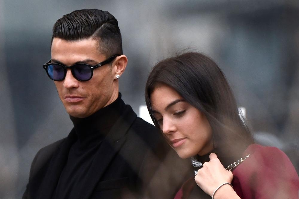 Juventus’ forward and former Real Madrid player Cristiano Ronaldo leaves with his Spanish girlfriend Georgina Rodriguez after attending a court hearing for tax evasion in Madrid Tuesday. — AFP 