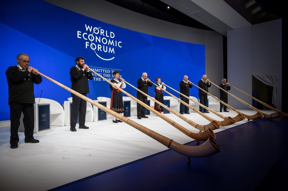 Alphorn blowers perform during the opening of the World Economic Forum (WEF) annual meeting on Tuesday in Davos, eastern Switzerland. — AFP