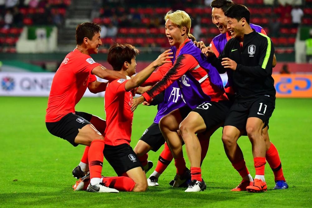 South Korea's defender Kim Jin-su (2nd L) celebrates his goal during the 2019 AFC Asian Cup Round of 16 match against Bahrain at the Rashid Stadium in Dubai Tuesday. — AFP 