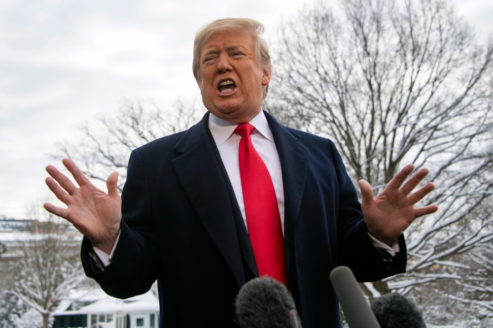 US President Donald Trump speaks to the media as he departs the White House in Washington in this Jan.14, 2019, file photo. — AFP