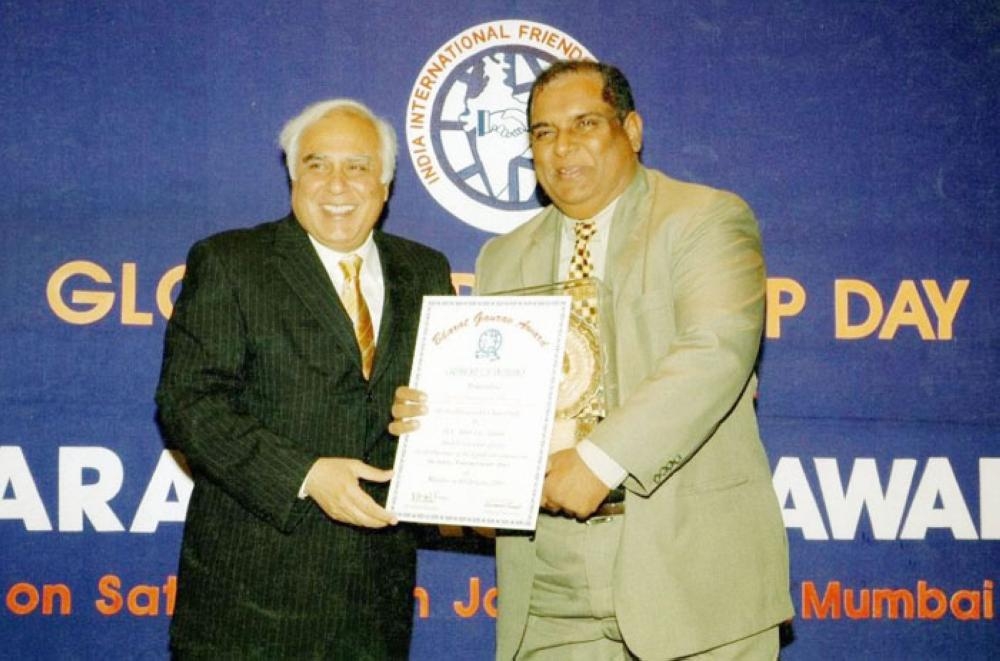 Mr & Mrs Masood receiving Hind Rattan Award from K.C. Pant, Ex-Defense Minister of India