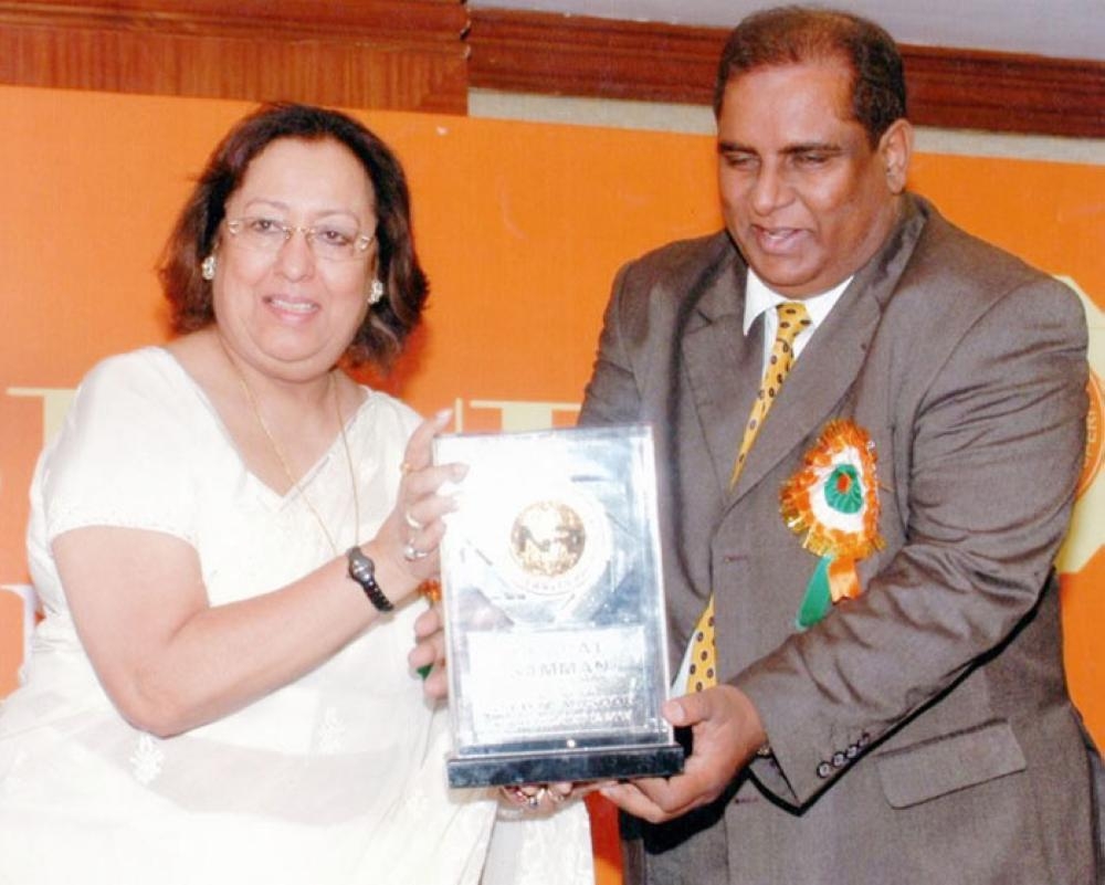 Mr & Mrs Masood receiving Hind Rattan Award from K.C. Pant, Ex-Defense Minister of India