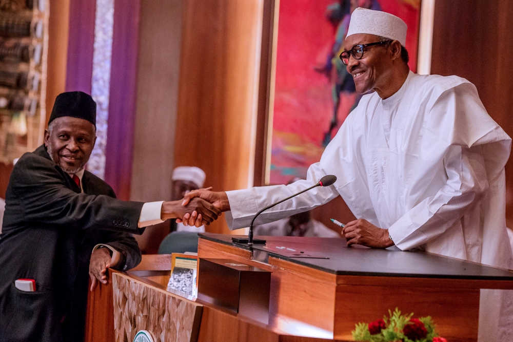 Nigeria's President Muhammadu Buhari swears in Tanko Mohammed as the acting Chief Justice in Abuja, Nigeria. — Reuters