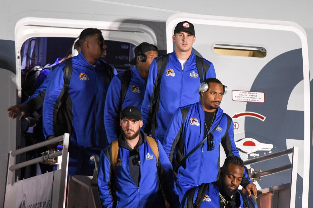 Los Angeles Rams’ players get off the plane at Hartsfield-Jackson Atlanta International Airport ahead of Super Bowl Sunday. — Reuters 