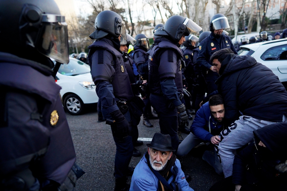 Taxi drivers disrupt traffic to protest against ride-hailing services in central Madrid, Spain, on Monday. — Reuters