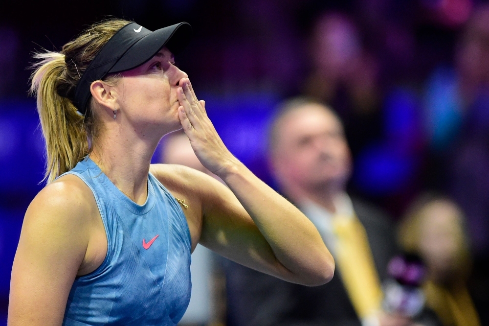 


Russia's Maria Sharapova thanks supporters after defeating Australia's Daria Gavrilova during their match at the St. Petersburg Ladies Trophy tennis tournament at Saint Petersburg's Sibur Arena on Monday. — AFP