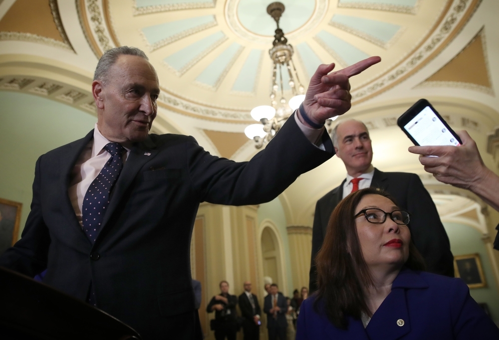 Senate Minority Leader Chuck Schumer (D-NY) answers questions following the Democratic policy luncheon on Tuesday in Washington, DC. — AFP