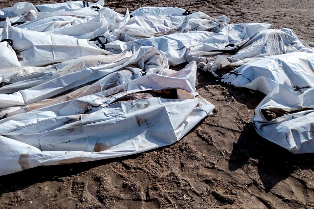 A picture tshows bodies in body bags collected on beach in Obock, Djibouti, after two migrant boats capsized off the coast. The death toll from the sinking of two migrant boats off the coast of Djibouti has risen to 31, the UN migration agency said on wednesday, with scores still feared missing.  — AFP