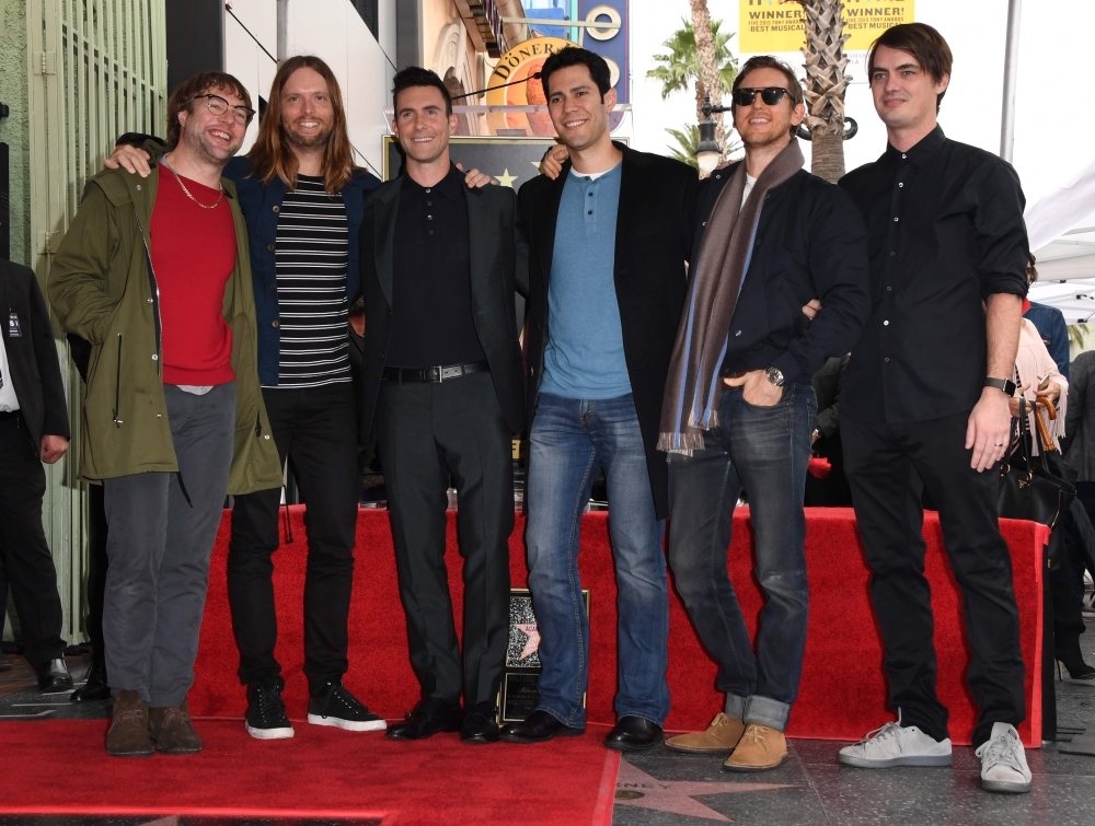 In this file photo, recording artist Adam Levine (3rd L) poses with his band Maroon 5 after he was honored with a Star on the Hollywood Walk of Fame in Hollywood, California. The NFL canceled its traditional pre-Super Bowl press conference with stars of its halftime show amid reported criticism in the music world over the treatment of former San Francisco 49ers quarterback Colin Kaepernick. Three-time Grammy Award-winning band Maroon 5 will headline the halftime concert in Atlanta on Sunday, one of the highlights of the biggest event on the US sporting calendar. — AFP