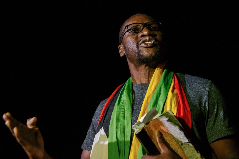 Zimbabwe cleric and activist Pastor Evan Mawarire speaks to the press after his release on bail from Chikurubi Maximum Prison in Harare, Zimbabwe, on Thursday. — AFP