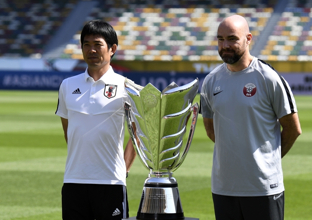 Japan's player Maya Yoshida (R) with head coach Hajime Moriyasu (L) attend the pre-match press conference ahead of the AFC Asian Cup final match against Qatar at the Zayed Sports City Stadium in Abu Dhabi on Thursday. — AFP