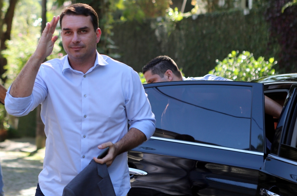 Flavio Bolsonaro, son of Brazil’s President Jair Bolsonaro, salutes as he arrives to record an electoral program for television in Rio de Janeiro, Brazil, in this Oct. 23, 2018 file photo. — Reuters 