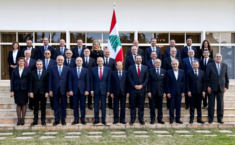 A handout picture shows Lebanese President Michel Aoun (first row C), Prime Minister Saad Hariri (first row C-R), and Parliament Speaker Nabih Berri (first row C-L) posing with members of the newly-formed cabinet, including Rayya al-Hassan (first row L) the first female Interior Minister in Lebanon and the Arab world, at the presidential palace in Baabda, east of the capital Beirut. The new cabinet, unveiled during a press conference at the presidential palace, includes 30 ministers from Lebanon's rival political clans. The new line-up is to see four women take up office, including the interior and energy ministries. AFP 