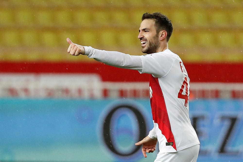 AS Monaco’s Cesc Fabregas celebrates scoring their second goal against Toulouse at Stade Louis II in Monaco Saturday. — Reuters