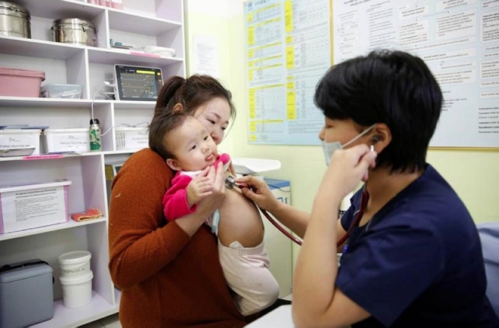 Ulzii-Orshikh Otgon, 34, visits a doctor for her 10-month-old daughter Achmaa, diagnosed with pneumonia, at a children’s hospital in Bayangol district of Ulaanbaatar, Mongolia. — Reuters
